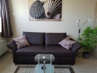 Breite Couch mit klappbaren Seitenteilen
